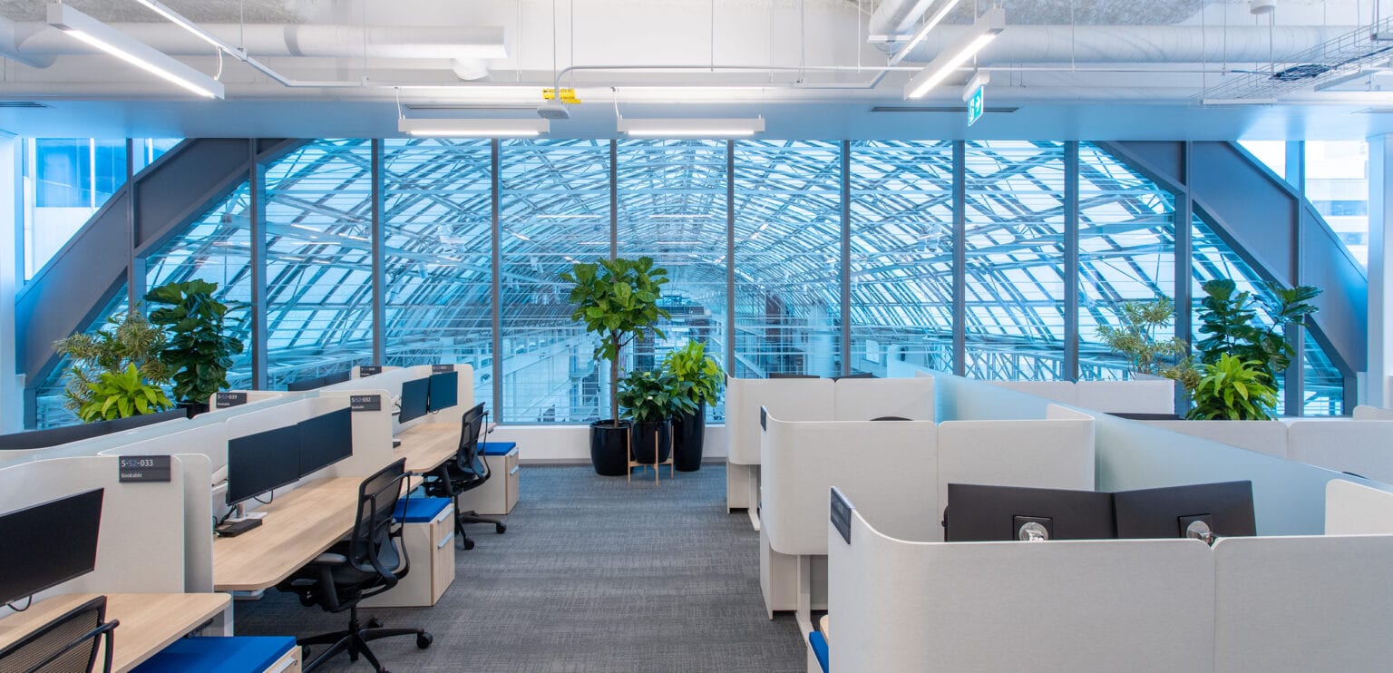 office space with window looking out at the Eaton Centre's arched skylight.