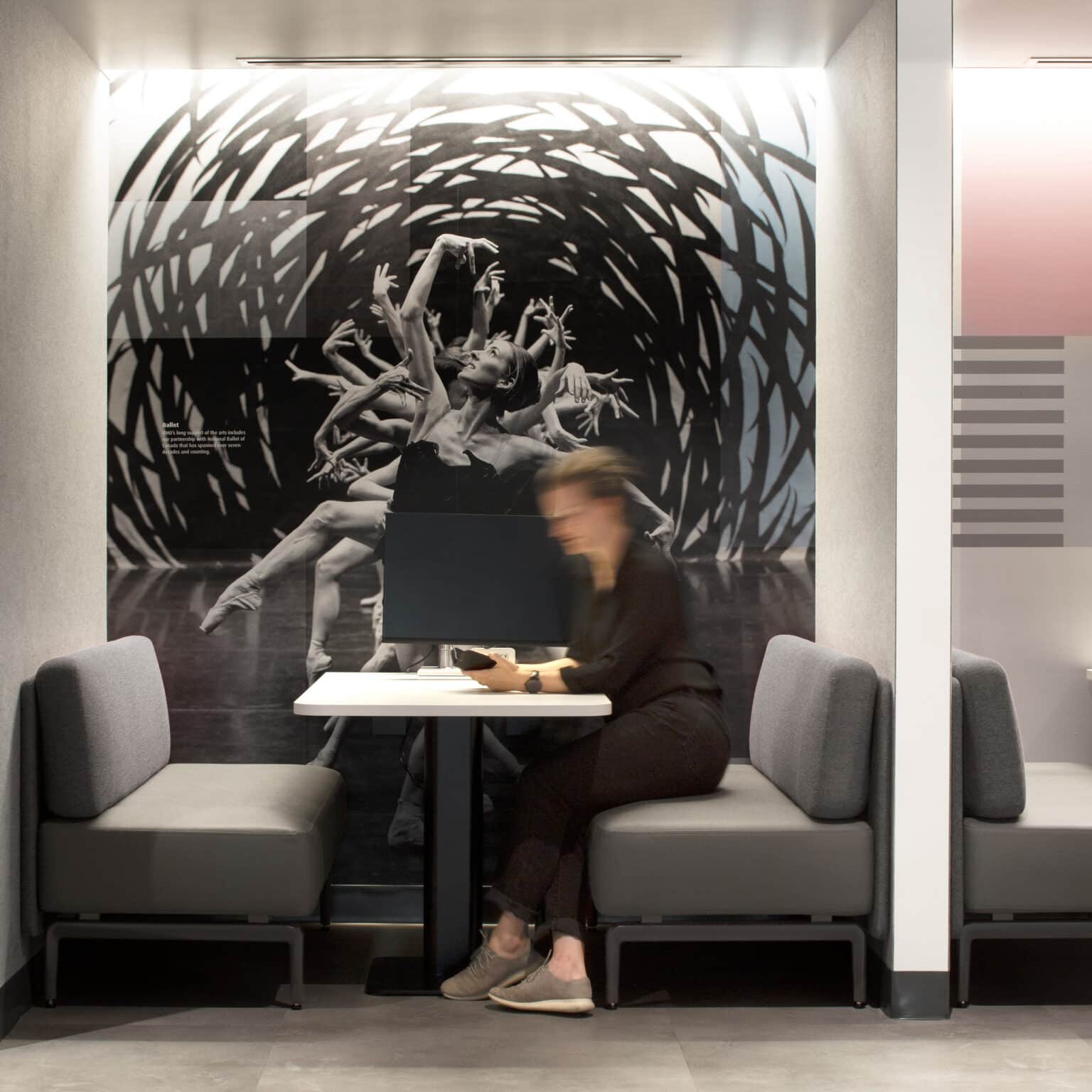 Wall graphic in work booth with ballerina dancer photograph combined with graphics.