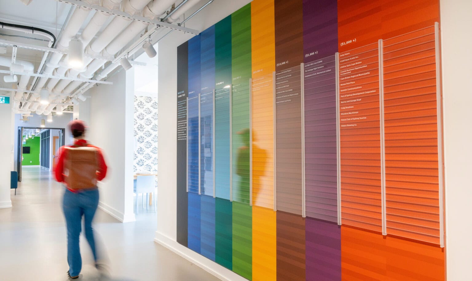Eltuek Arts Centre donor wall - a series of vertical bright coloured blanks featuring donor names and a message of thanks.