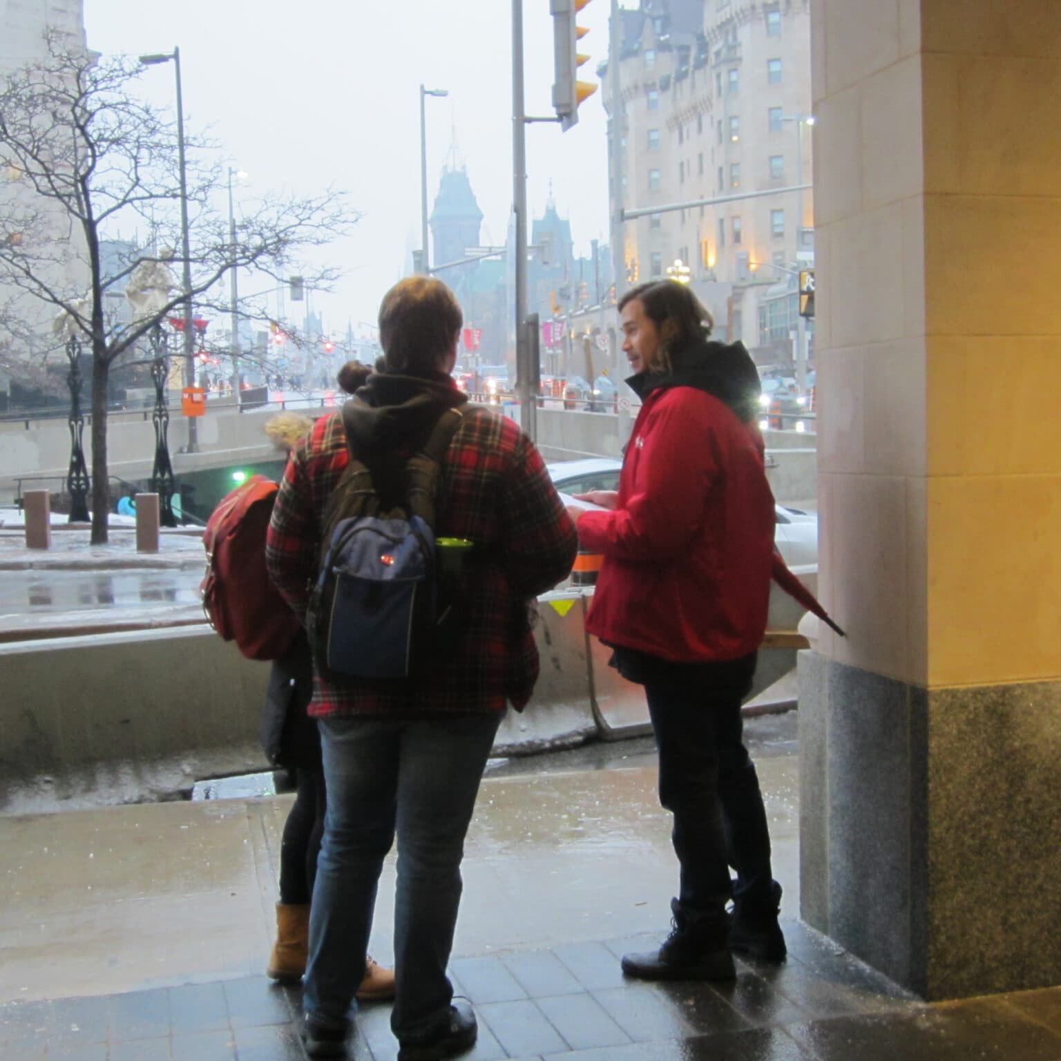 Entro researcher interviewing pedestrians in downtown Ottawa.