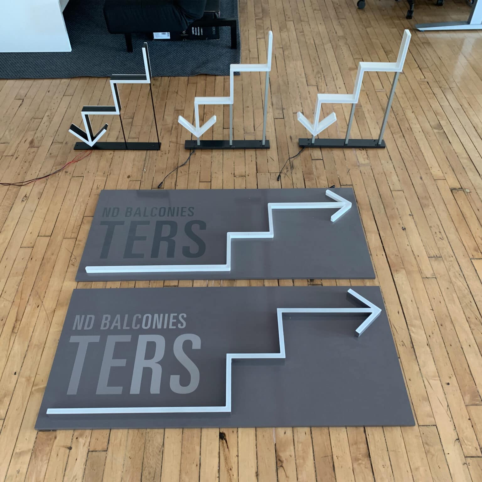 Illumunated arrows for PAC NYC directional signage, prior to be assembled and installed.
