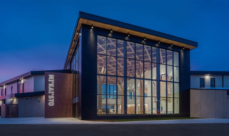 Mi'kai'sto Red Crow Community College exterior building at dusk