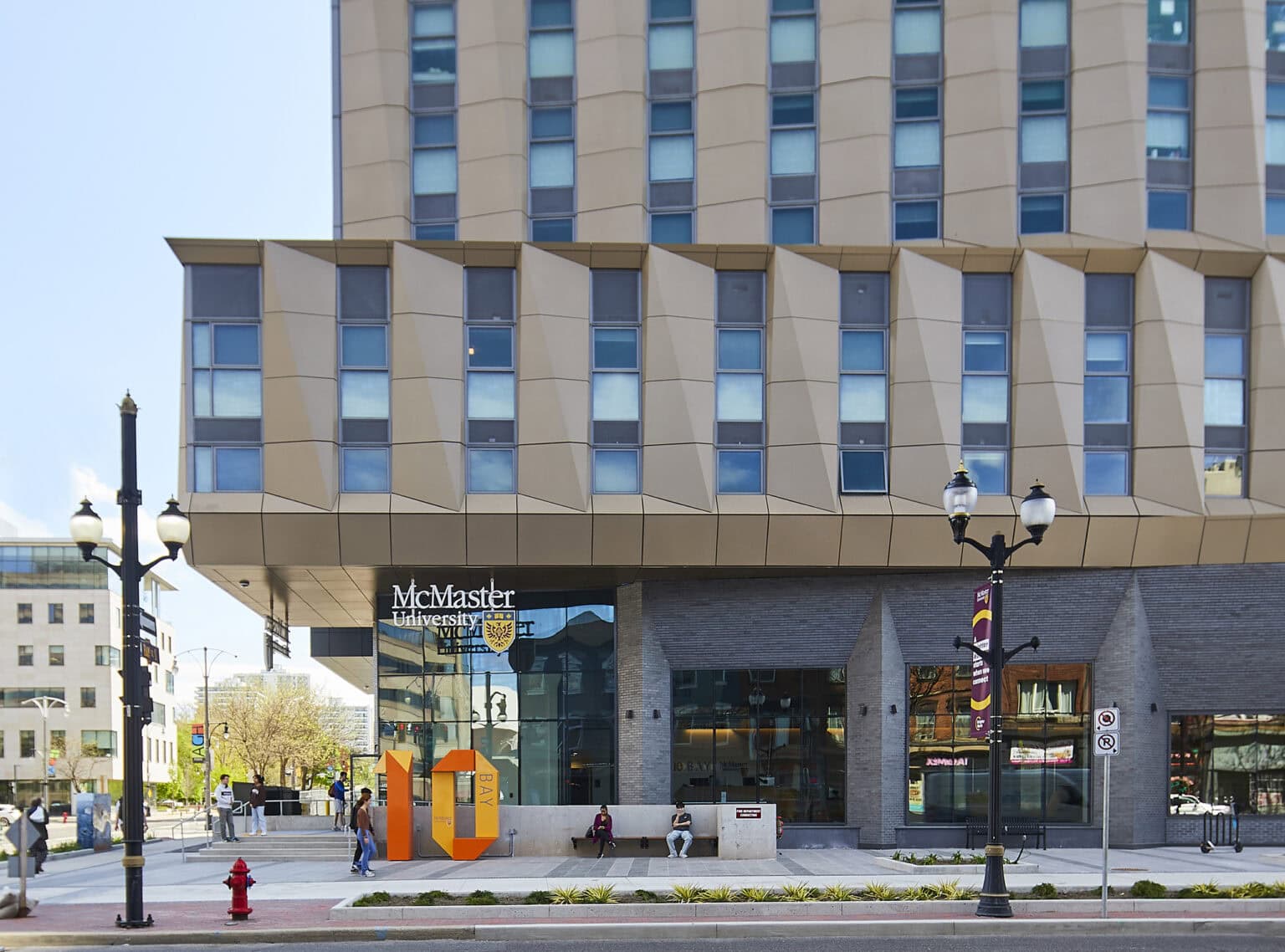 McMaster University 10 Bay Student Residence street scape showing landmark sign