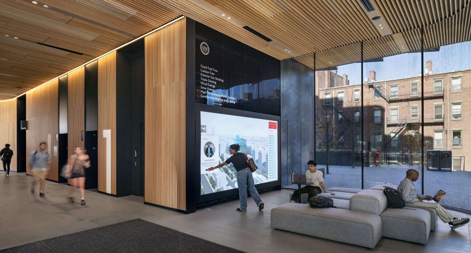 Center for Computing and Data Sciences lobby with floor to ceiling digital screen showing sustainability information