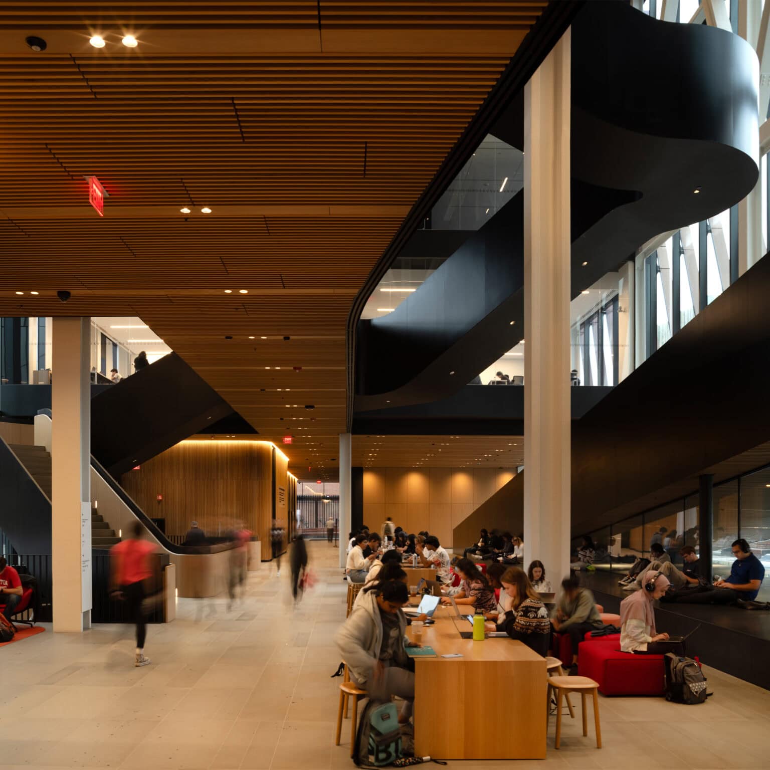 Center for Computing and Data Sciences interior showing open floor plan with collaboration work spaces surrounded by curving staircases