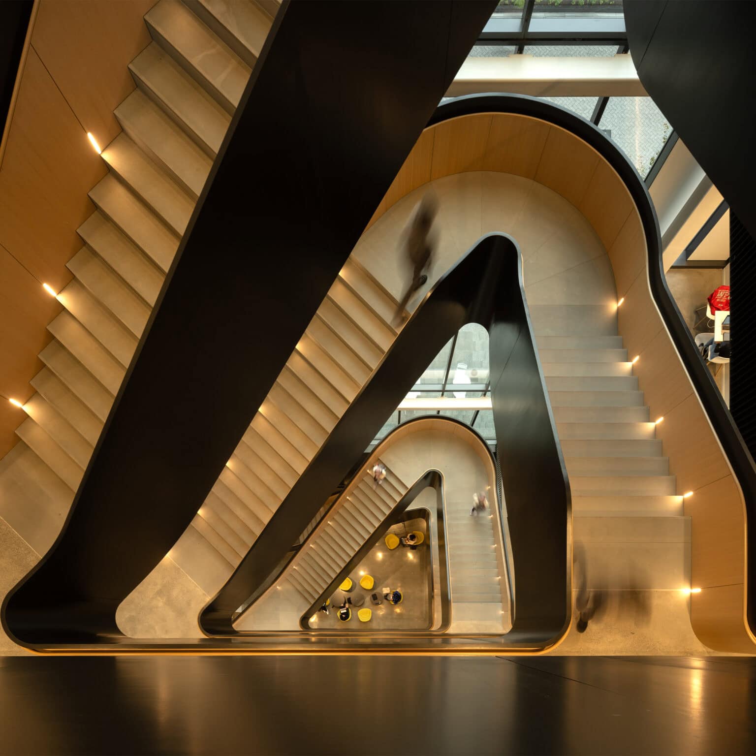 Center for Computing and Data Sciences interior ariel view of stunning curved staircase.