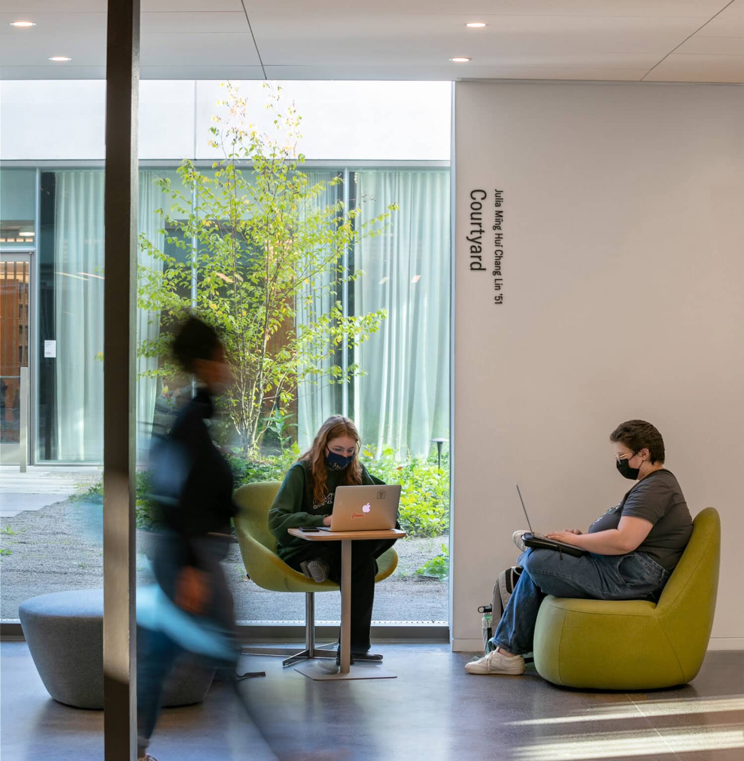 Neilson Library interior lounge area with students working