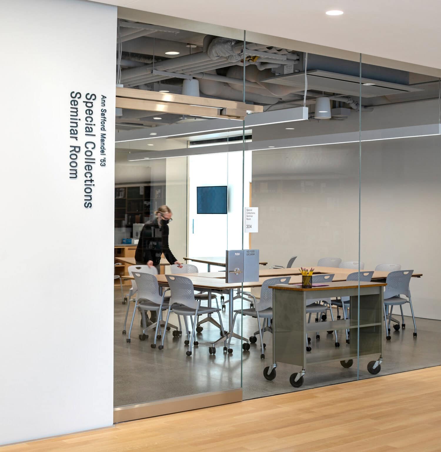 Neilson Library Special Collections Seminar room with glass wall and workspaces