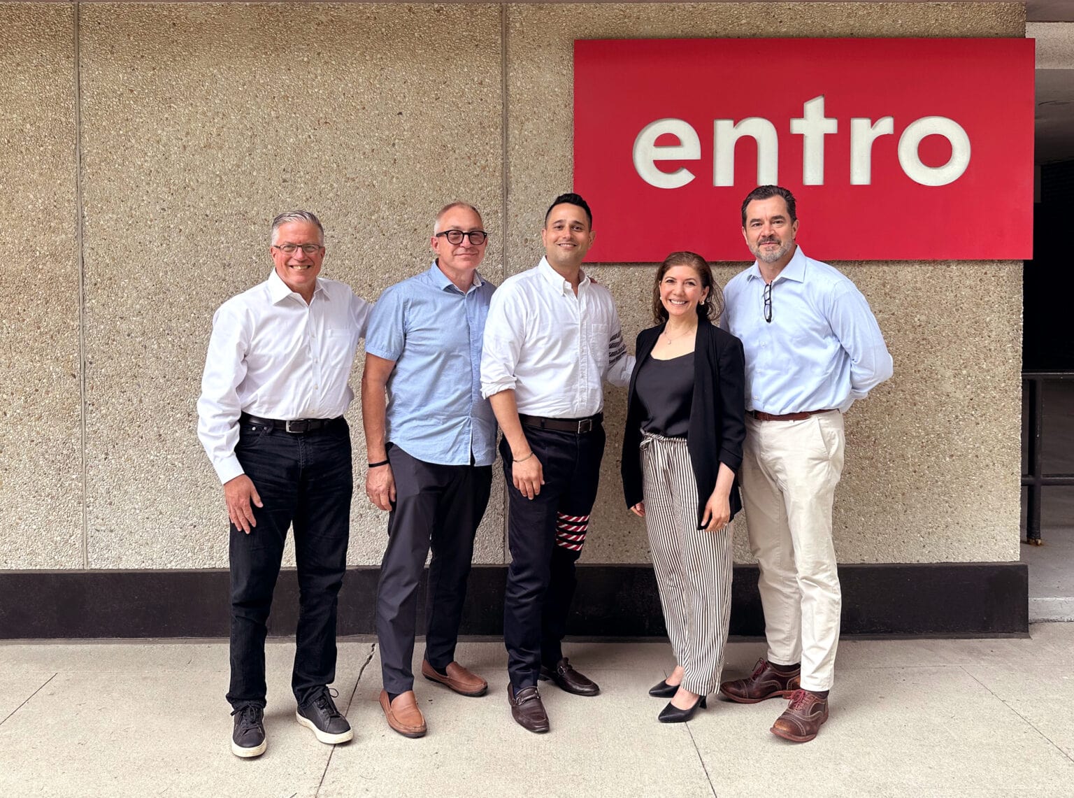 Members of Entro and Astria Elevate leadership team standing outside