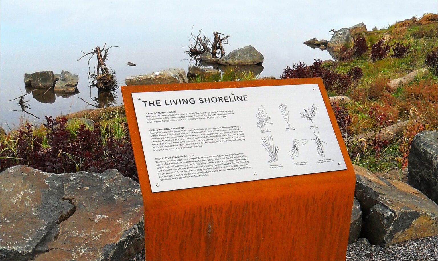 Prince Arthur's Landing rusted steel interpretive sign in landscape