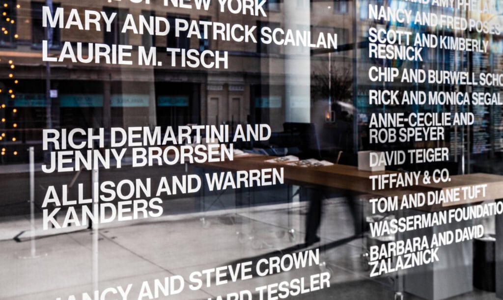 silver vinyl on glass for the primary donor wall, offering a subtle yet distinguished acknowledgment of support.