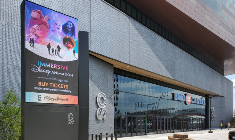 Exterior digital pylon sign featuring event